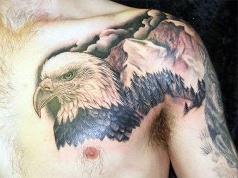 Eagle tattoo on top of a mountain