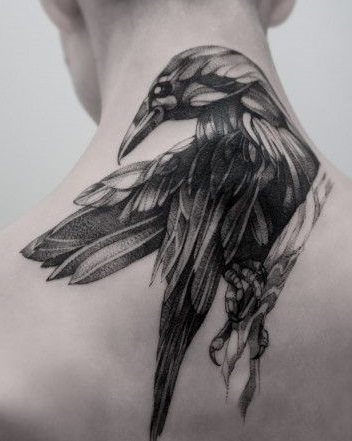 Tattoo in the form of a raven will look quite impressive on the back of the neck
