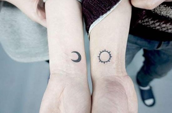 Tattoos on two arms for girls, men's on tear, inscriptions. Photo