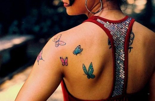 Tattoos on the spine (back) of girls: hieroglyphs, inscriptions with translation, flowers, dot, runes, planets, lines. Beautiful sketches