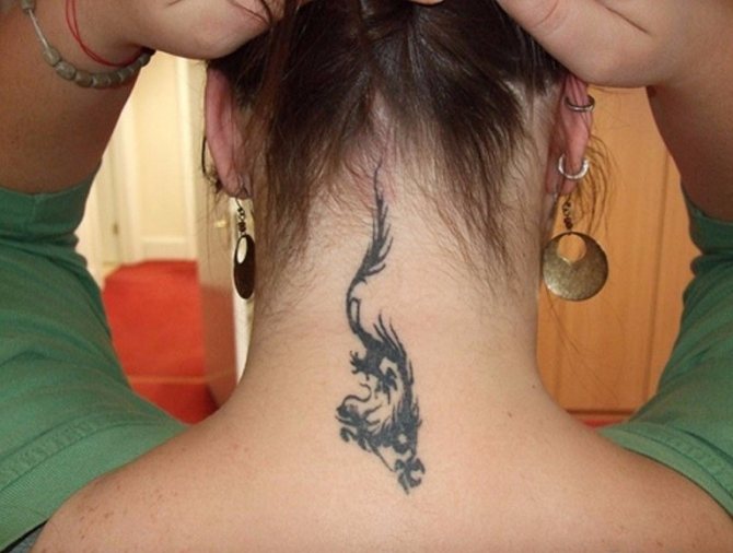 Tattoos on the back of a girl's neck