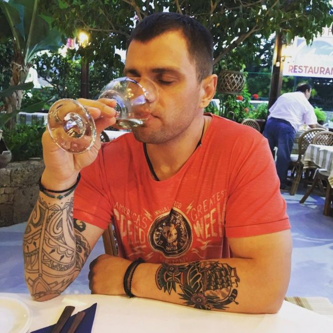 Roman Pashkov tattoos on his arm