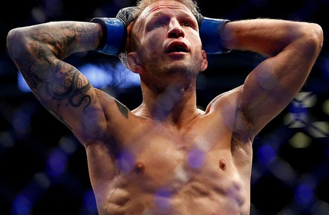 T.J. Dillashaw with a snake tattoo on his biceps