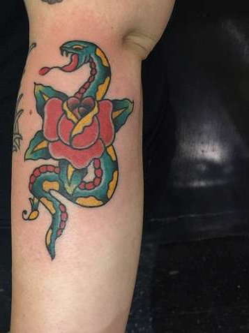 Typical old skool style tattoo - snake with a rose