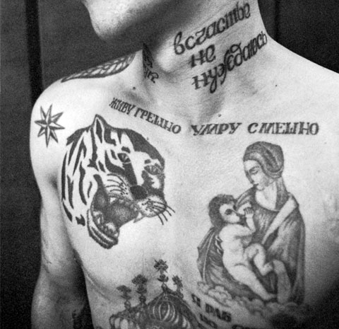 Criminal tattoo of Our Lady and Child on chest