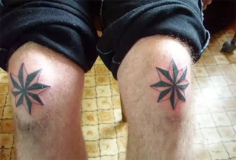 Criminal tattoo of a wind rose on his knees