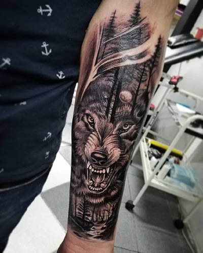 Wolf with open mouth tattoo. Meaning of the picture, photo