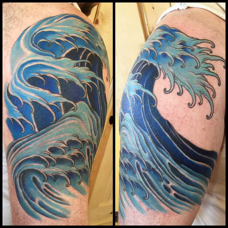 Wave tattoo on the shoulder