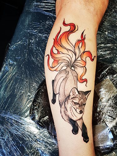 Japanese mask of a fox Kitsune tattoo. Meaning, sketch, photo