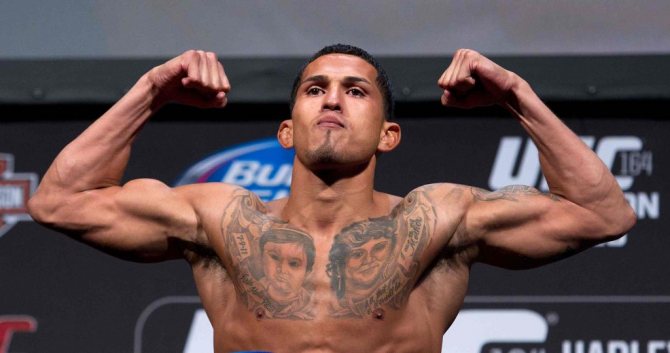 Female faces tattooed on Anthony Pettis' chest