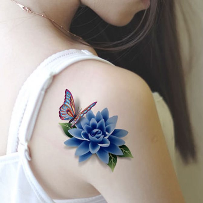 Bright flower and butterfly female tattoo on the shoulder