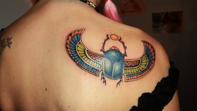 Scarab beetle tattoo. Meaning, sketches, photos on legs, arms, wrist, back, neck