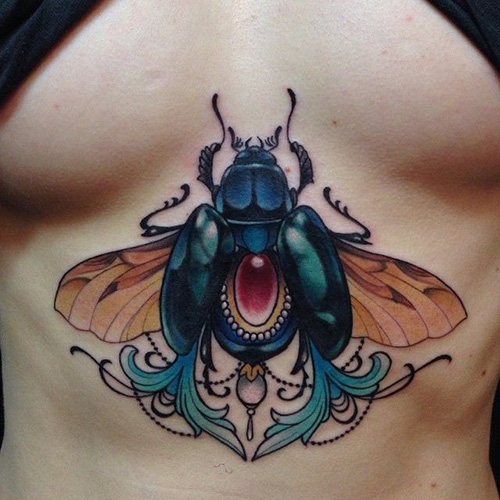 Scarab beetle tattoo. Meaning, sketches, photos on legs, arms, wrist, back, neck
