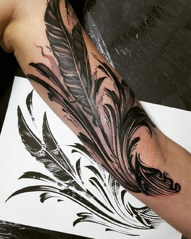 Tattoo of a feather on a girl