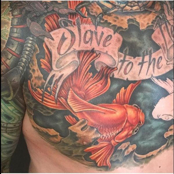 Goldfish tattoo on chest